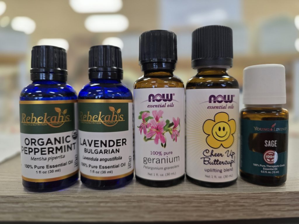 Variety of essential oil brands for sale at Rebekah's store.